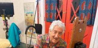 Gil Dellinger artist obituary - at the easel - image courtesy of the Dellinger family